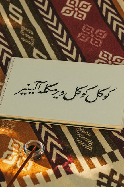 Elegant Persian calligraphy on a traditional patterned rug with warm lighting.